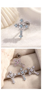 Macro detail of cross stud earrings with colorful cubic zirconia and screw backings