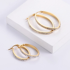 Polished gold egg-shaped hoop earrings with sparkling crystal pavé for women