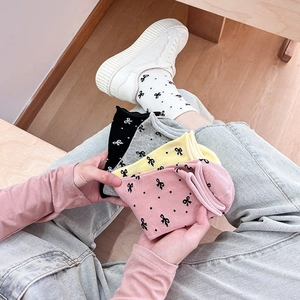 Cotton mid-calf socks with bow patterns in white, pink, yellow, grey and black colors