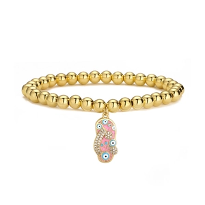 Detail of 18K gold-plated beaded bracelet featuring pink enamel evil eye charm and zircons