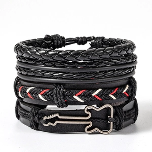 Detail of multi-layer black leather bracelets set featuring a vintage metal guitar charm