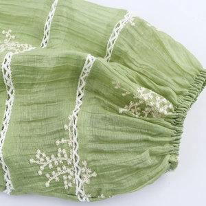 French style green embroidered dress with V-neck long sleeves and floral lace details