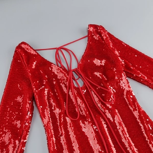 Detail of red sequin dress featuring an open back with deep V-neckline and tie closure