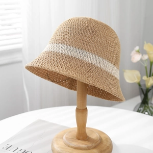 Close-up of the breathable woven mesh and white stripe detail on this summer bucket hat