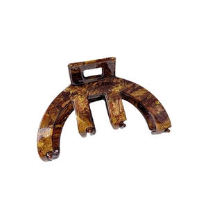 Tortoiseshell acetate claw clip with a minimalist arched hollow design on white background
