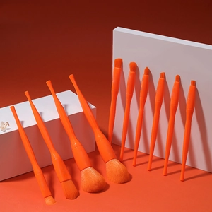 10-piece professional makeup brush set in vibrant orange for foundation and eyeshadow