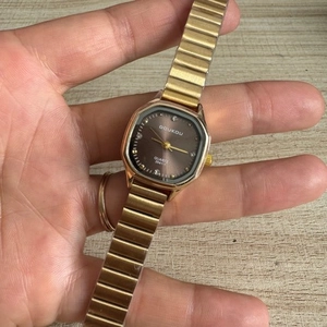 Elegant gold metal square dial watch for women with brown face and quartz movement