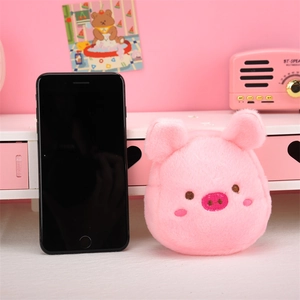 Cute pink plush pig coin purse with embroidered details shown next to a smartphone