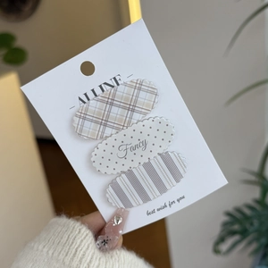 Set of three cute wavy oval hair clips with plaid, polka dot and striped patterns