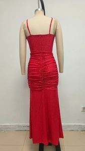 Detail of red sequined dress showing back zipper, waist ruching and fitted hip profile