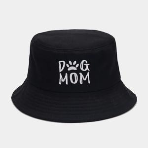 Close-up of DOG MOM embroidery with paw print on black cotton canvas bucket hat