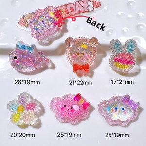 Macro shot of assorted cute 3D resin fruit and animal charms for DIY crafts and accessories