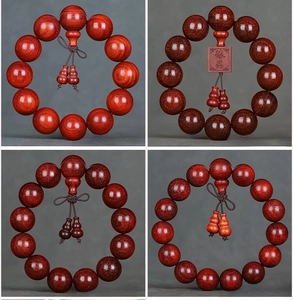 Macro detail of polished red sandalwood prayer beads with natural wood grain and oils
