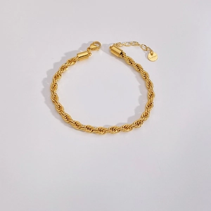 Close-up of golden stainless steel rope chain bracelet with secure lobster clasp