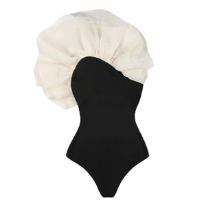 Chic black one-piece swimsuit with asymmetrical white mesh ruffles for beach vacation