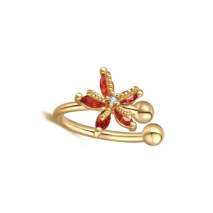 Detailed shot of golden flower ear cuff with red marquise cubic zirconia petals