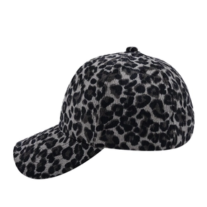 Detail of grey leopard print baseball cap with textured corduroy fabric and curved brim