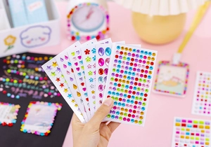 Detailed view of colorful acrylic diamond stickers in heart, star, and flower shapes for DIY