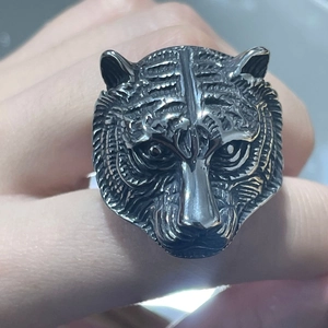 Close-up of vintage tiger head ring made of solid stainless steel for men
