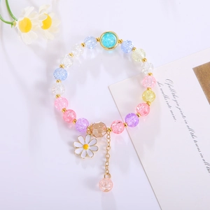 Detailed shot of colorful cracked crystal bracelet featuring a white daisy flower charm