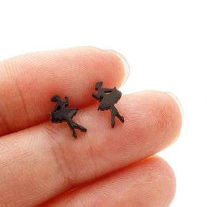 Close-up of black ballet dancer stud earrings held by hand to show compact size