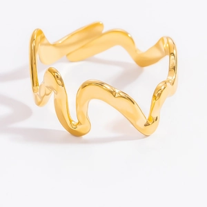 Close-up of a luxury gold wave design stainless steel open ring on a white background