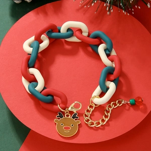 Detail of Christmas chain bracelet with red, green links and a reindeer charm