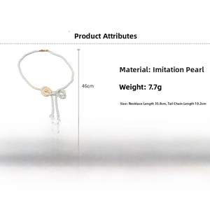 Detail view of pearl bow necklace showing length specifications and weight information