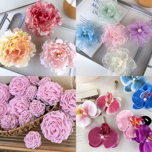 Elegant fabric floral shark hair clips in assorted colors like pink and lavender for women