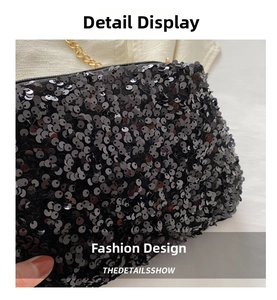 Close-up macro shot of black sequins and gold chain strap on the evening handbag