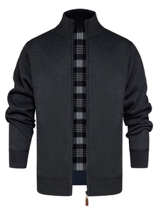 Detail of dark grey knit cardigan with a ribbed stand collar and plaid inner lining