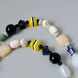 Close-up of colorful mixed resin beads and marble textured stones for DIY bag chains