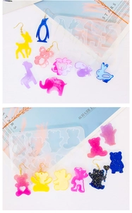 Macro detail of various animal-shaped silicone molds for DIY resin jewelry and earrings