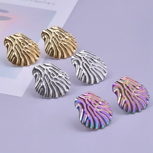 Detailed view of abstract shell-shaped 304 stainless steel earrings in gold, silver, and rainbow