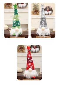 Close-up of glowing Christmas gnomes with snowflake knit hats in red, green, and grey