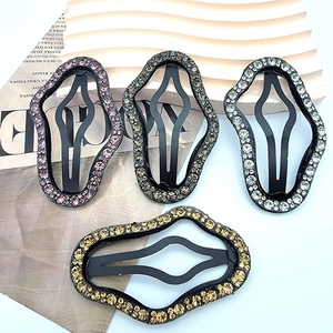 Set of four wavy rhinestone hair clips in purple, grey, silver and gold finishes