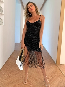 Detail of elegant black sequin dress with fringes and V-neckline for evening wear