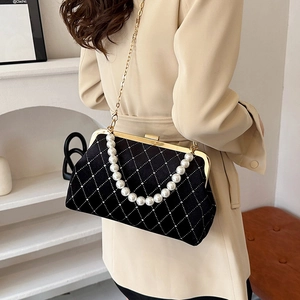 Elegant black velvet shell bag with diamond quilting, pearl handle and metal chain