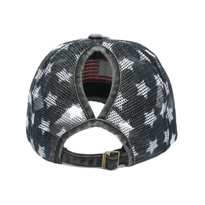 Detail of black washed ponytail cap featuring a rear mesh design and metal buckle adjustment