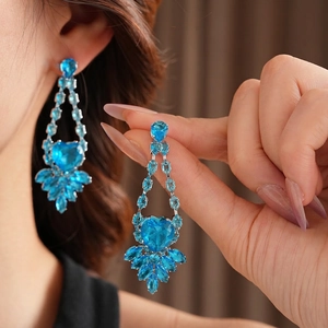 Luxury silver heart earrings with light blue gemstones for formal evening wear