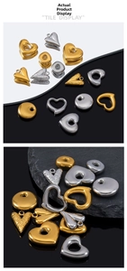 Macro shot of gold and silver heart-shaped stainless steel charms for DIY jewelry making