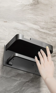 Detail showing smooth matte black metal edges and rounded corners of the wall shelf