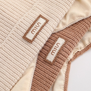 Chic pointed knit baby hat with warm satin lining and miu patch in beige and brown