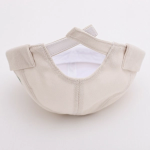 Detail of adjustable velcro strap on corduroy docker hat with fine ribbed texture