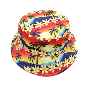 Detailed view of bucket hat with tropical sunset, palm trees, and dense stitching detail