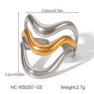 Detail view of two-tone wavy open ring with dimensions 2.02cm width and 2.7g weight