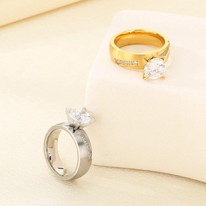 Detailed close-up of four-prong set round cubic zirconia on brushed stainless steel ring