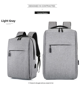 Detail view of light grey backpack with built-in USB charging port and sleek business design