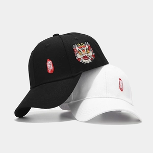 Black and white baseball caps featuring traditional lion dance and Guochao embroidery