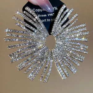 Exaggerated gold fan-shaped stud earrings with sparkling rhinestones for women